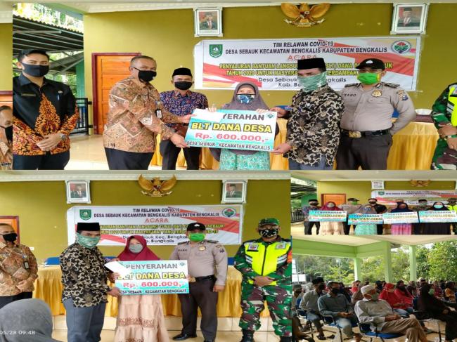 Kades Sebauk Tamrin Salurkan BLT-DD dan Ratusan Masker